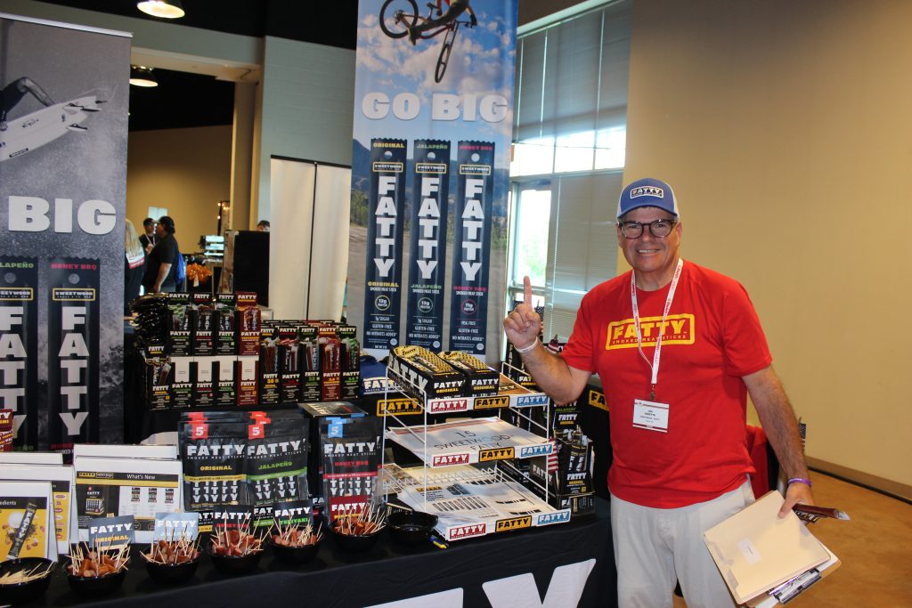 vendors at food table at trade show